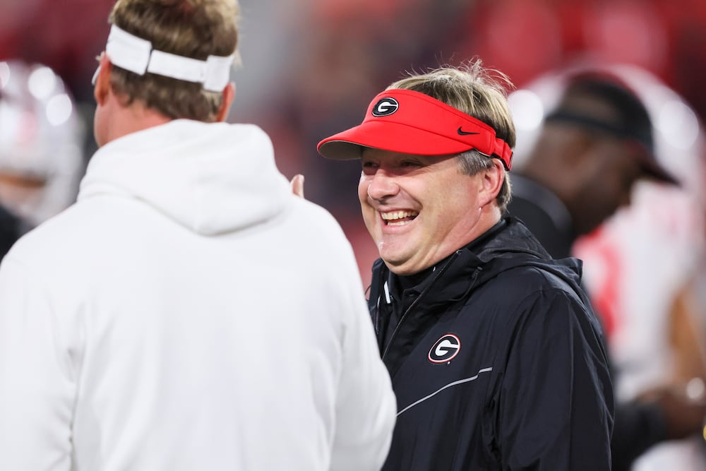 Georgia head coach Kirby Smart (right) speaks with then-Mississippi head coach Lane Kiffin before their game at Sanford Stadium on Saturday, Nov. 11, 2023, in Athens. (Jason Getz/AJC)